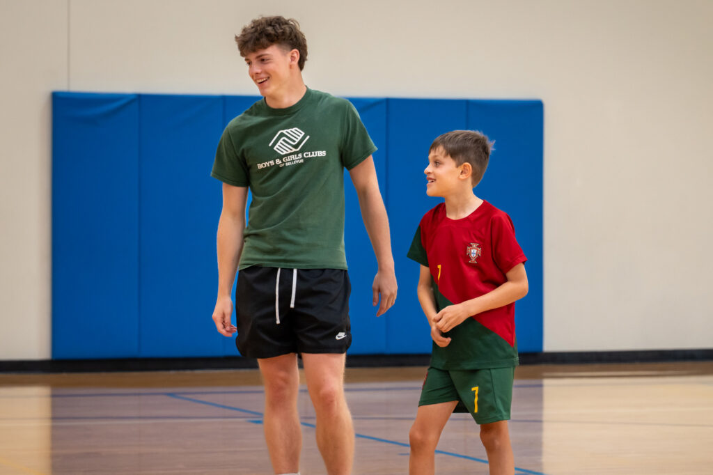 Staff and Club Kid on a basketball court.
